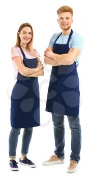Man and woman in aprons on white background�