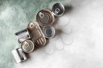 Tin cans with food on light background�