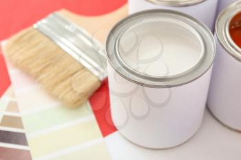 Can of paint on color background, closeup�
