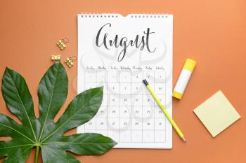 Flip paper calendar and stationery on color background�