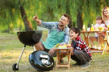 Father with son having picnic on summer day�