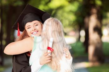 Happy mother greeting her daughter on graduation day�