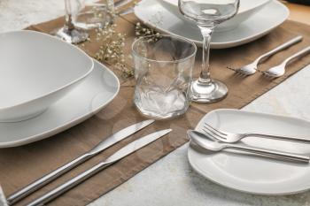 Beautiful table setting on grey background�