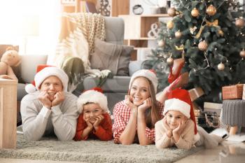 Happy family at home on Christmas eve�