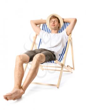 Young man relaxing on sun lounger against white background�