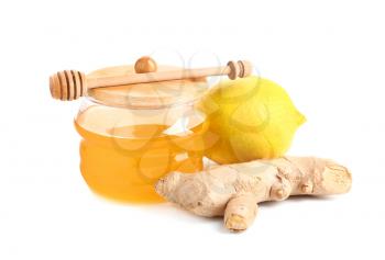 Jar of fresh honey, lemon and ginger on white background�
