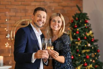 Happy couple celebrating Christmas at home�