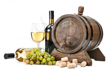 Barrel, bottles and glass of tasty wine on white background�