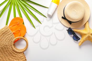 Summer composition with beach accessories on white background�