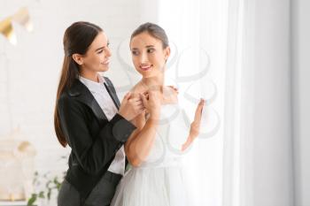 Beautiful lesbian couple during wedding ceremony�