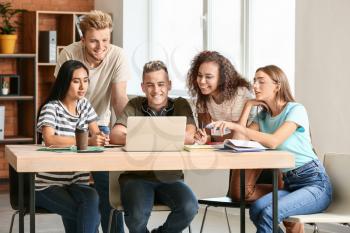 Group of students preparing for exam in university�