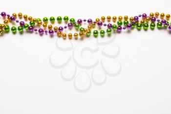 Colorful beads on white background�