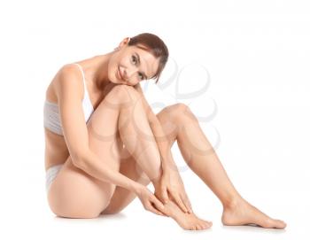 Woman with beautiful legs after depilation on white background�