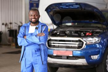 African-American mechanic in car service center�