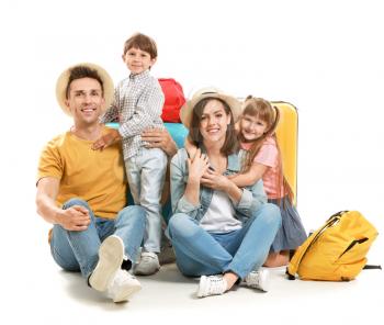 Happy family with suitcases isolated on white�