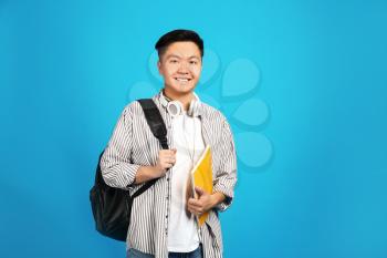 Portrait of Asian student on color background�