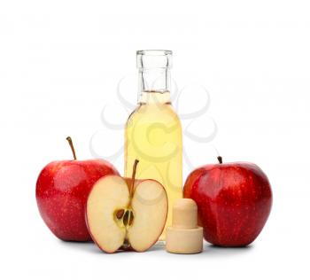 Bottle of apple cider vinegar on white background�