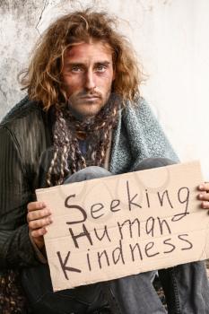 Portrait of poor homeless man outdoors�