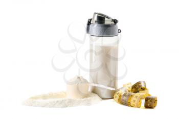 Bottle of protein shake with measuring tape on white background�