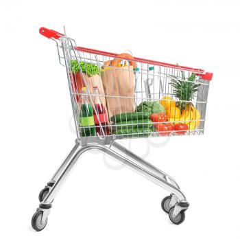Shopping cart with products on white background�