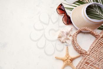 Composition with beach accessories on light background�