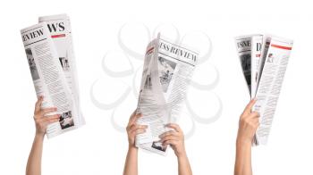 Female hands with newspapers on white background�