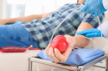 Man donating blood in hospital�