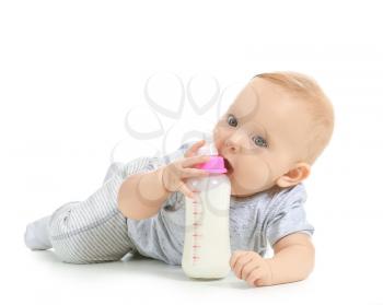 Baby with bottle of milk on white background�