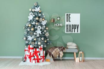Interior of room with decorated Christmas tree�