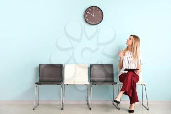 Young woman waiting for job interview indoors�