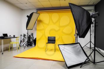 Chair and equipment in modern photo studio�