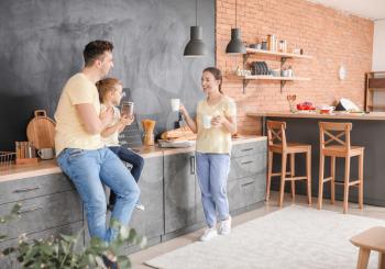 Young family in kitchen at home�
