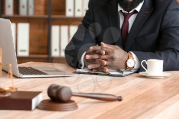 African-American lawyer at table in office�
