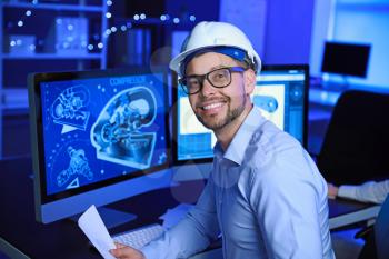 Portrait of male engineer in office at night�
