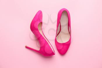 Stylish female shoes on pink background�