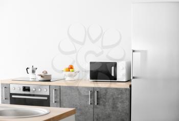 Interior of kitchen with modern microwave oven�
