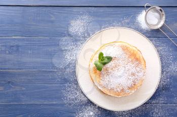 Plate with stack of tasty pancakes on table�