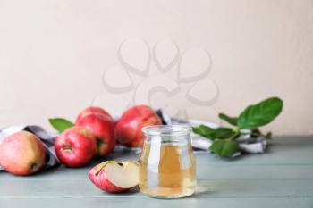Jar of apple cider vinegar on table�