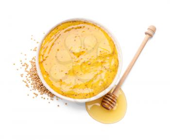 Bowl of tasty honey mustard sauce on white background�
