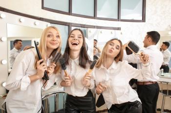 Young women during professional courses in hairdresser's salon�