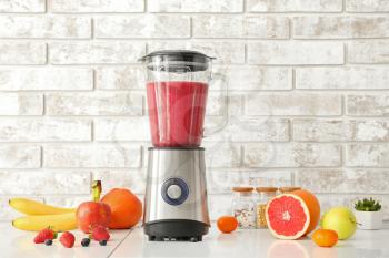 Blender with ingredients for healthy smoothie on kitchen table�