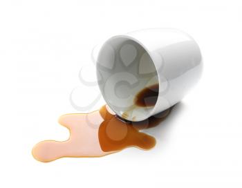 Overturned cup and spilled coffee on white background�