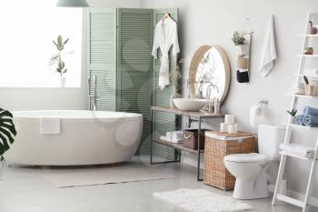 Stylish interior of modern bathroom with toilet bowl�