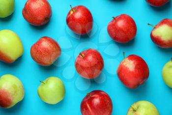 Different ripe fresh apples on color background�