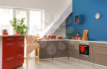 Interior of modern kitchen with stylish furniture�