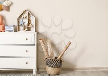 Chest of drawers with clothes and toys in children's room�