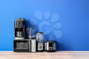 Different household appliances on table�