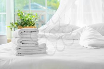 Clean towels on bed at home�