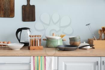 Set of utensils and products on kitchen counter�