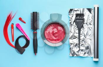 Supplies for hair coloring on color background�